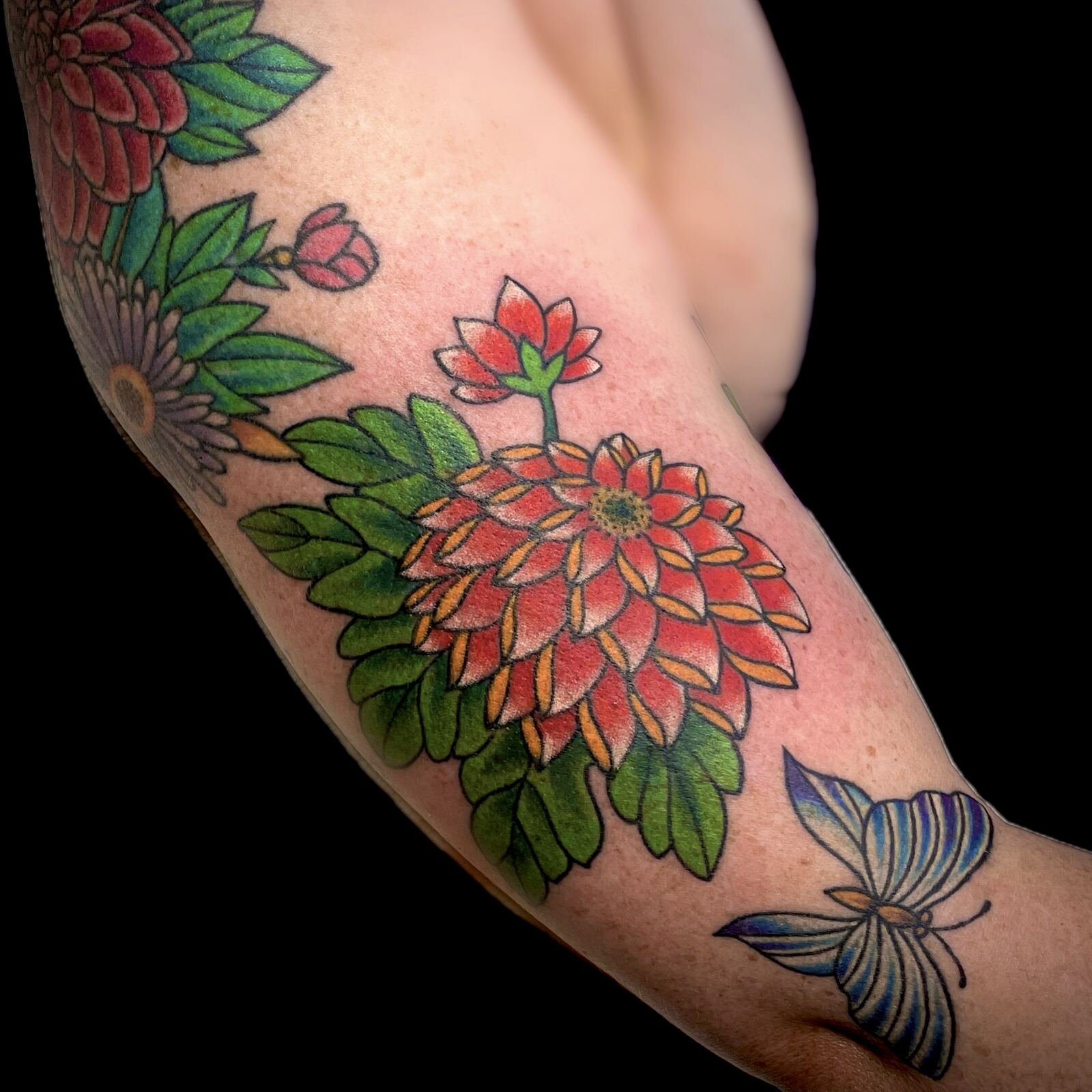 Colour floral tattoo with butterfly detail by Mark C. Merchant, tattoo artist in Dallas, TX